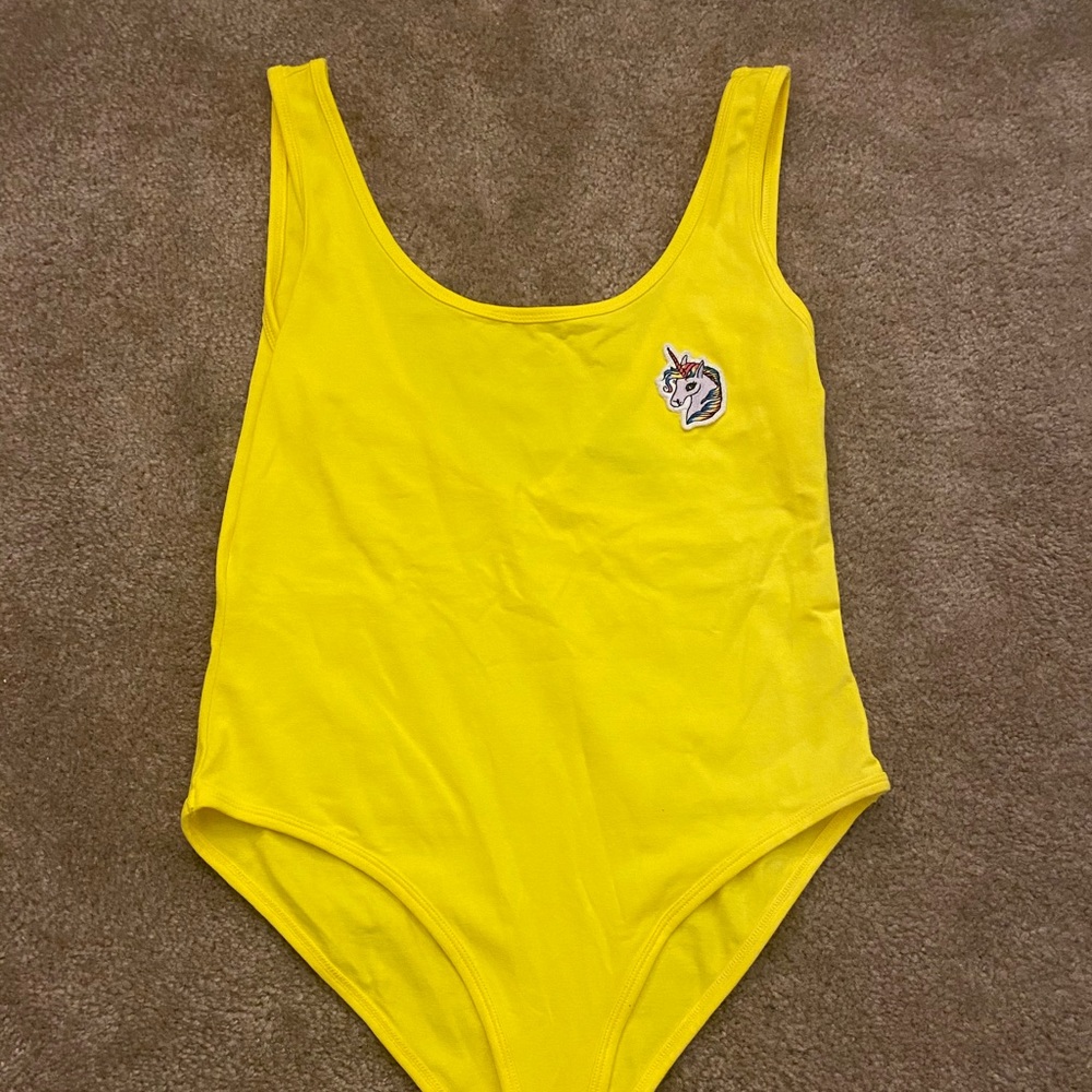 Unicorn bright yellow body suit